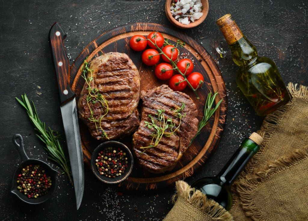 Grilled,Ribeye,Beef,Steak,,Herbs,And,Spices,On,A,Dark